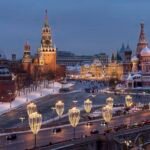 The Kremlin Wall, the Spasskaya Tower, Red Square, the GUM department store, the St. Basil's Cathedral and the Bolshoy Moskvoretsky Bridge are decorated for the New Year and Christmas festivities in Moscow, Russia, Thursday, Dec. 29, 2022. (AP Photo/Alexander Zemlianichenko)